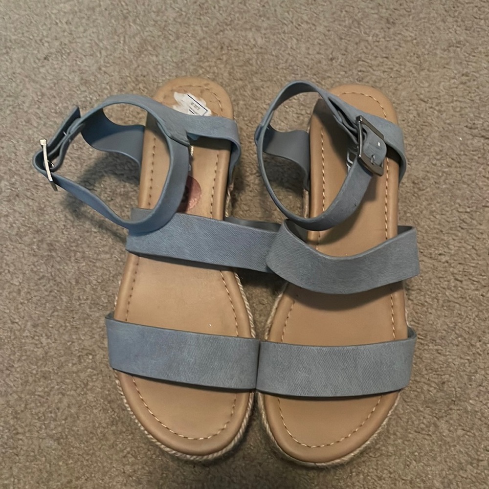 Women’s blue wedge sandals with two straps and tie around ankle.  For wide feet